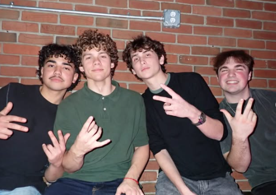 Four Delta Chi members together in East Lansing
