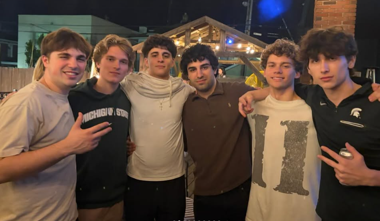 Six Delta Chi members together during a chapter night