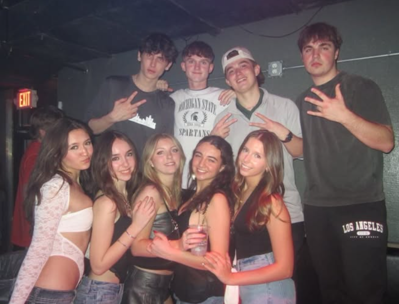 Delta Chi members and friends together at a social event